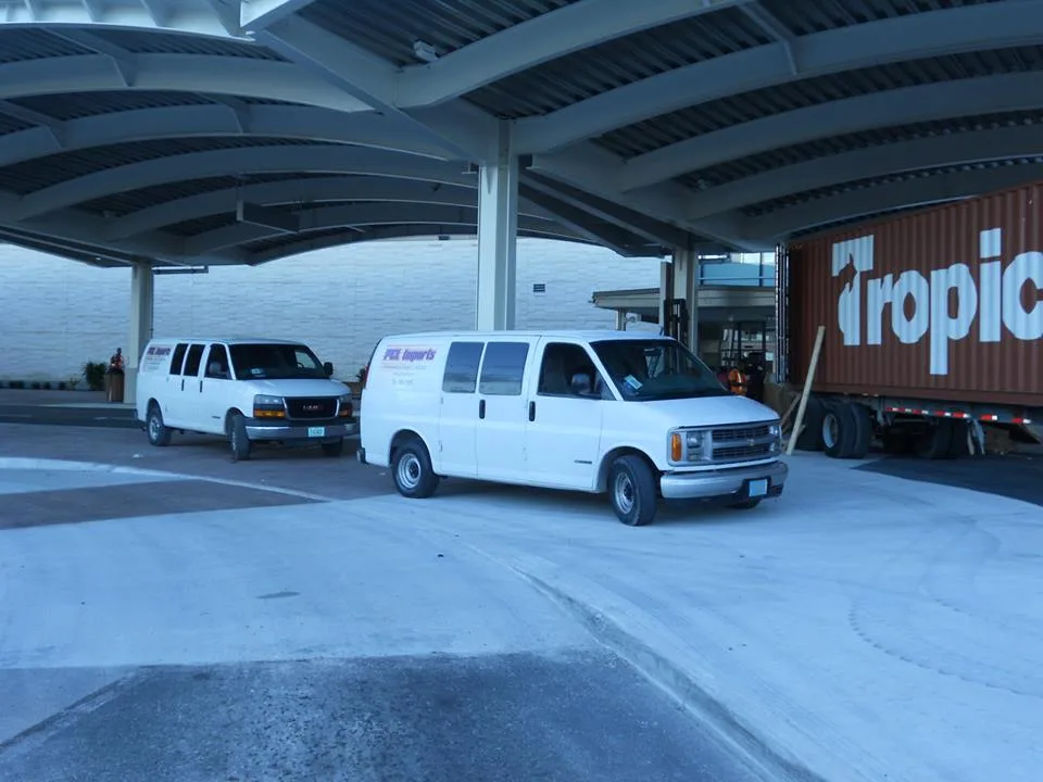 PCL Imports branded vans at the cargo terminal